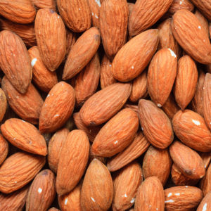 Healthy food, good for heart health.  Almonds as background.